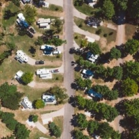 RV Park Full Hookup Sites Aerial Drone Flyover - Indigo Bluffs